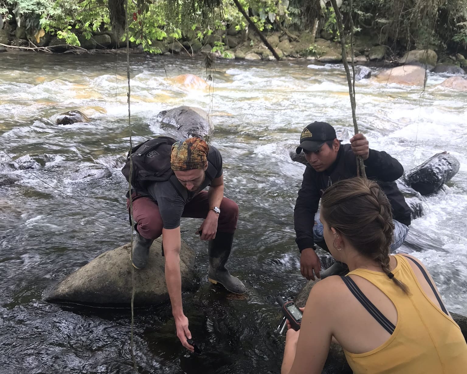 A team monitoring water quality in the river near Junin, Ecuador